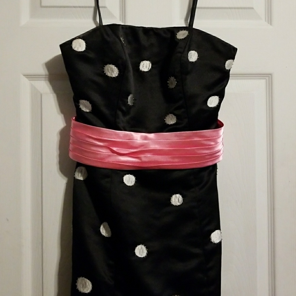 Black with white polka dots and pink belt
